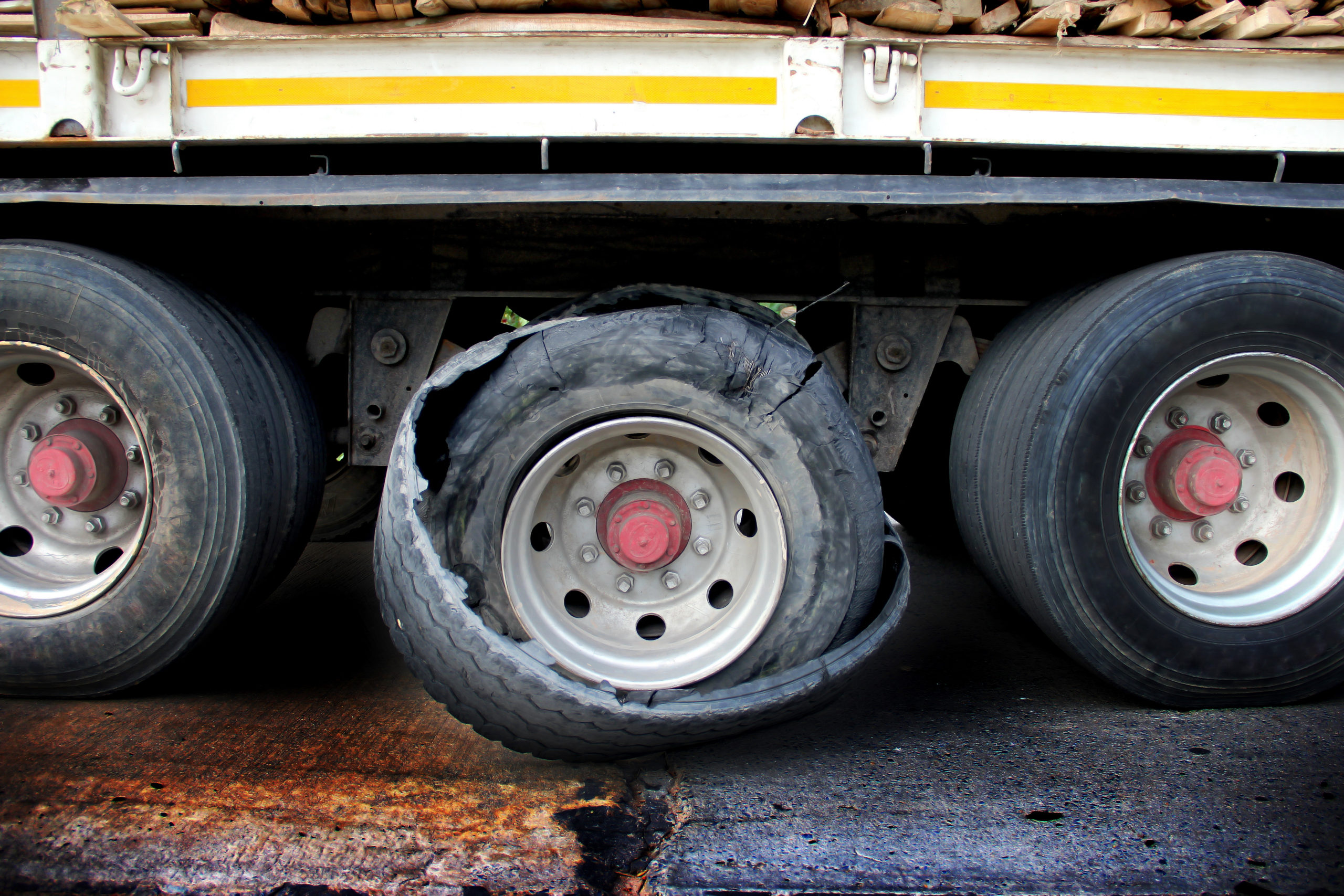 Damaged truck tires.damaged 18 wheeler semi truck burst tires by